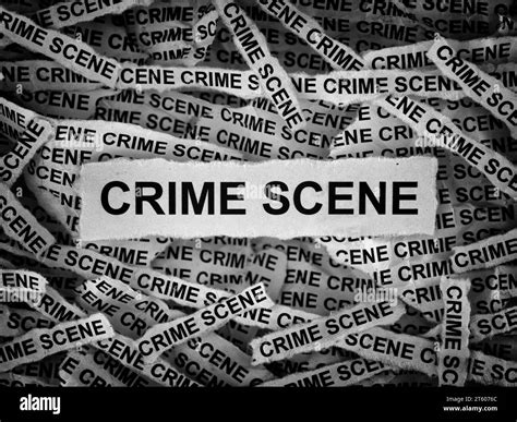 Strips of newspaper with the words Crime Scene typed on them. Black and ...