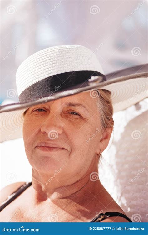 A Woman In A Straw Hat Close Up Portrait Of An Elderly Happy Woman In