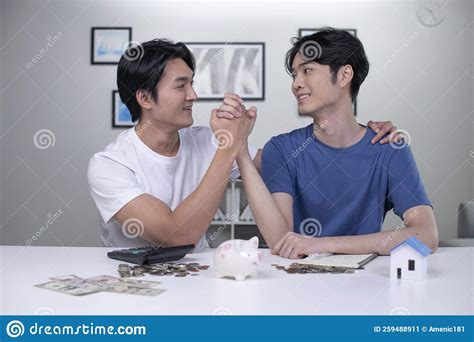 Asian Gay Couple Saving Money To Buy A House Lgbt Men Couple Saving