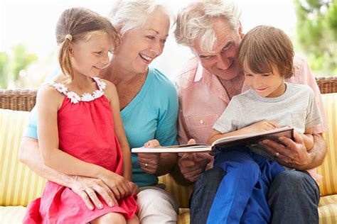 Grandpa Telling A Story At His Grandson Stock Photos Pictures