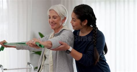 Woman Nurse And Dumbbell In Elderly Care For Physiotherapy Exercise