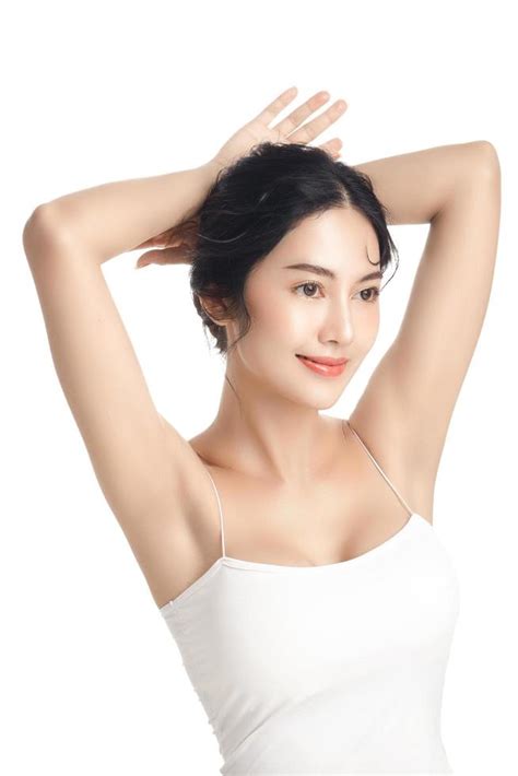 Asian Woman With A Beautiful Face And Perfect Clean Fresh Skin Cute Female Model Rising Arm