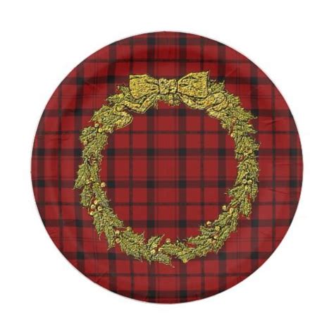 A Red And Black Plaid Plate With A Gold Wreath On It