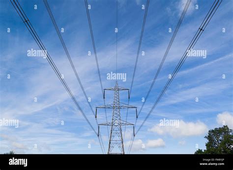 Power Or Electricity Lines Crossing The Countryside On Pylons Used To