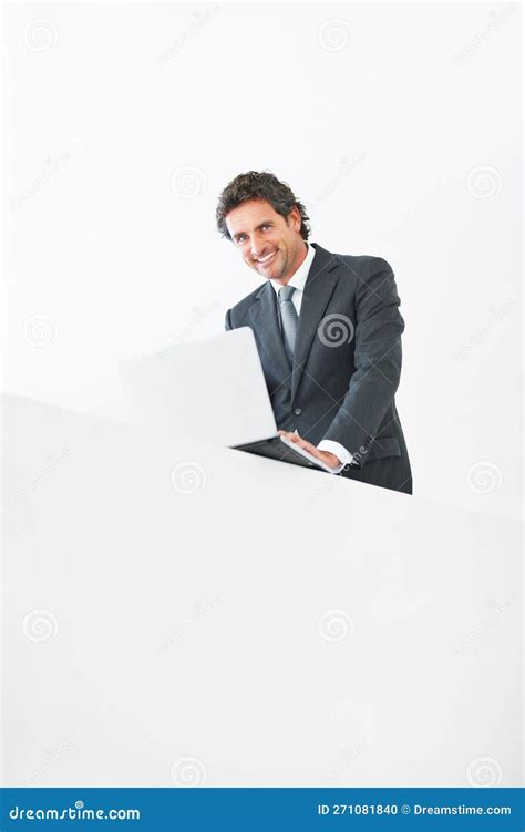 Smiling Business Man Standing With Laptop On Wall Low Angle View Of