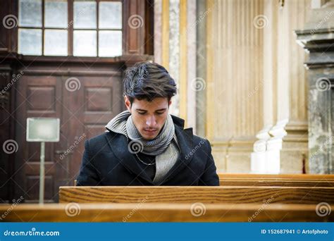 Young Man Sitting And Kneeling Praying In Church Stock Image Image Of