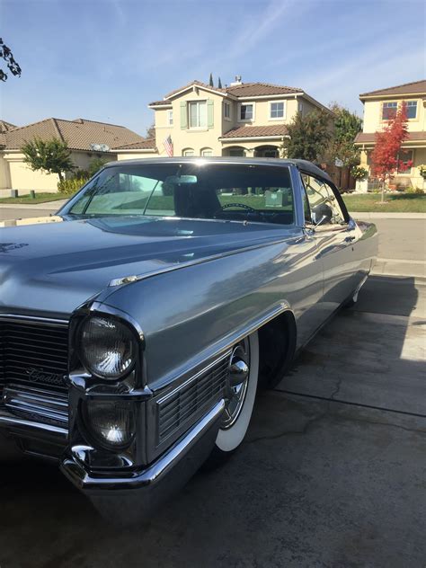 Vintage Car Parked in Front of a House