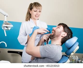 Doctor Examines Oral Cavity On Tooth Stock Photo Shutterstock