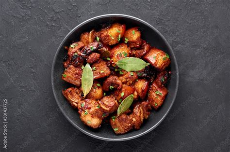 Foto De Adobo Pork In Black Bowl At Dark Slate Background Pork Adobo