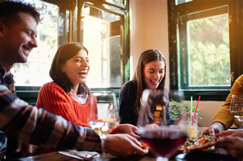 Group Of Happy People Eating Pizza In A Restaurant Stock Photo ...