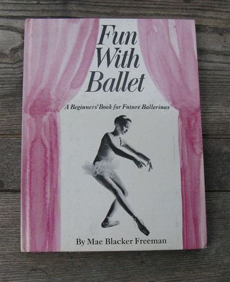 A Book About Ballet Is Sitting On A Wooden Table