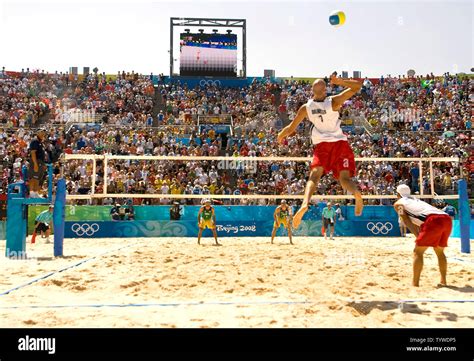 Usas Philip Dalhausser Serving And Todd Rogers R Compete In The