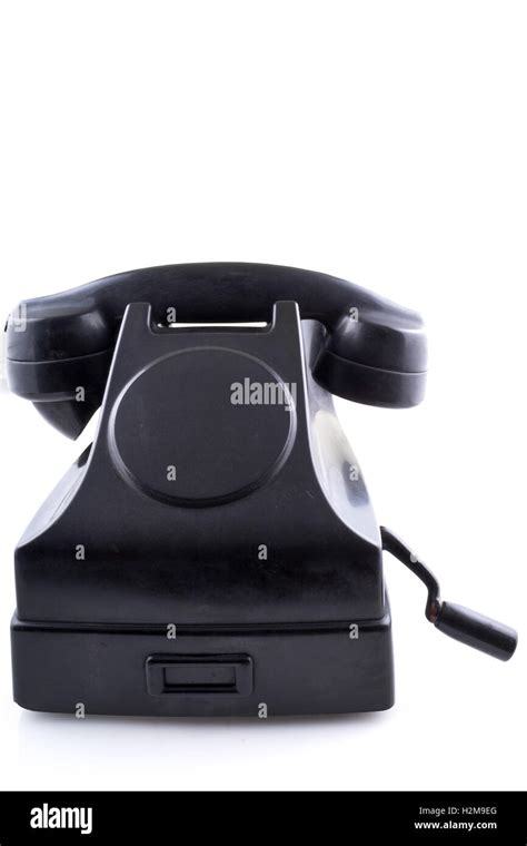 Old black vintage telephone, white background Stock Photo - Alamy