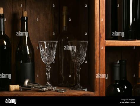 Bottles Of Wine And Glasses In Cellar Stock Photo Alamy