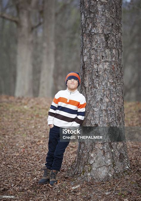 Kid Leaning Agaisnt A Tree Stock Photo Download Image Now Boys