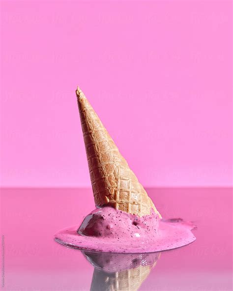 Scoops Of Berry Melting Ice Cream In Wafer Cones Are Reflected O By