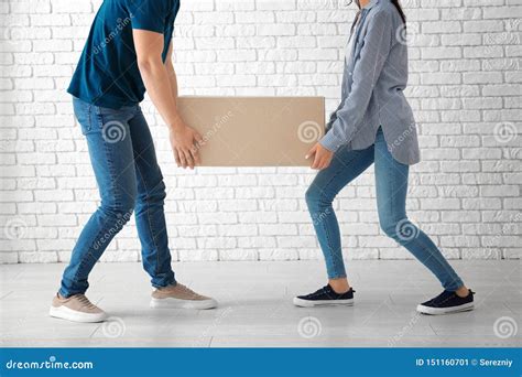 Young Couple Carrying Big Moving Box At New Home Stock Image Image Of