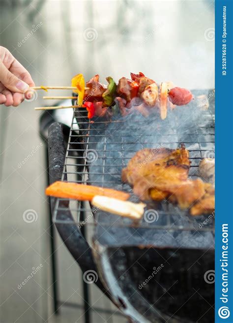 Delicious Grilled Meat With Smoke Bbq With Vegetables In Outdoor Barbecue Party Lifestyle