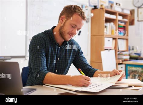 Teacher Marking Paperwork High Resolution Stock Photography And Images