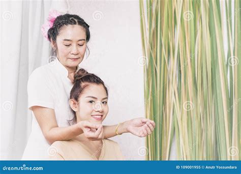 Young Woman Getting Shoulder And Neck Massage In Thai Spa Stock Image