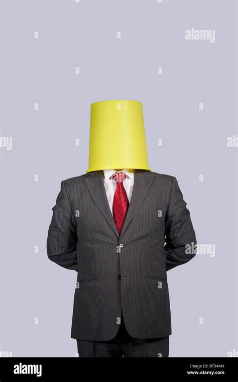 Businessman With A Bucket On His Head Stock Photo Alamy