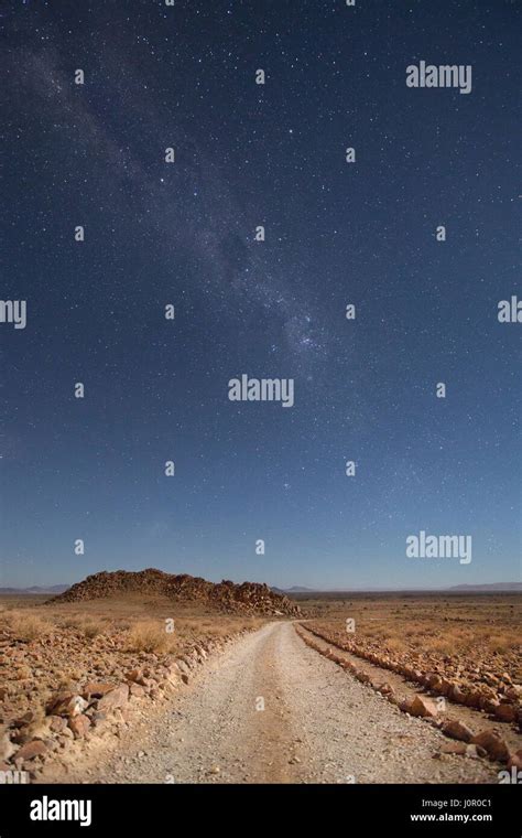 Desert road at night Stock Photo - Alamy