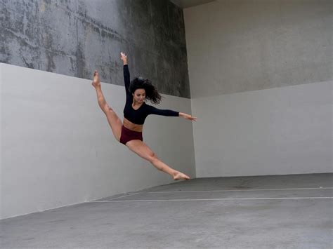 flexible dancer jumping  simple studio  stock photo