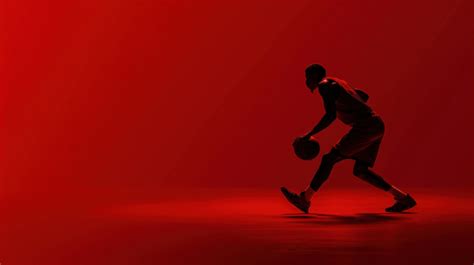 Basketball Player Silhouette Dribbling With Ball On Red Background