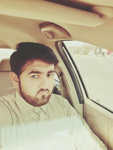 Premium Photo Portrait Of Man Sitting In Car