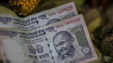 Rupee Slumps 10 Paise To Close Day At Record Low Of 7772 Against