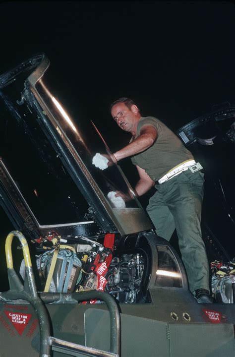 A Ground Crewman Cleans The Canopy Of An F 4g Wild Weasel Aircraft Of