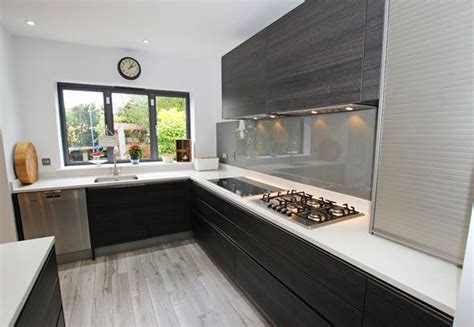 Black Handleless Kitchen With Base And Wall Units In Terra Oak Laminate