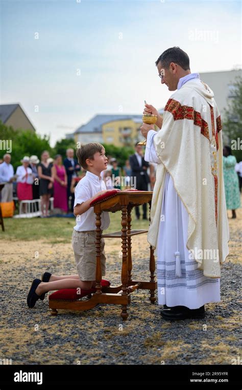 A Child Receiving The First Holy Communion Stock Photo Alamy