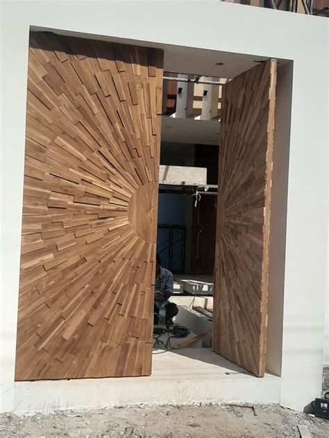 An Open Wooden Door On The Side Of A Building