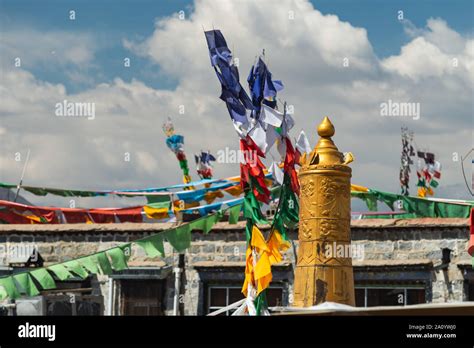 Prayer Flags Fly From Poles Across The Rooftops Of Lhasa Tibet Stock