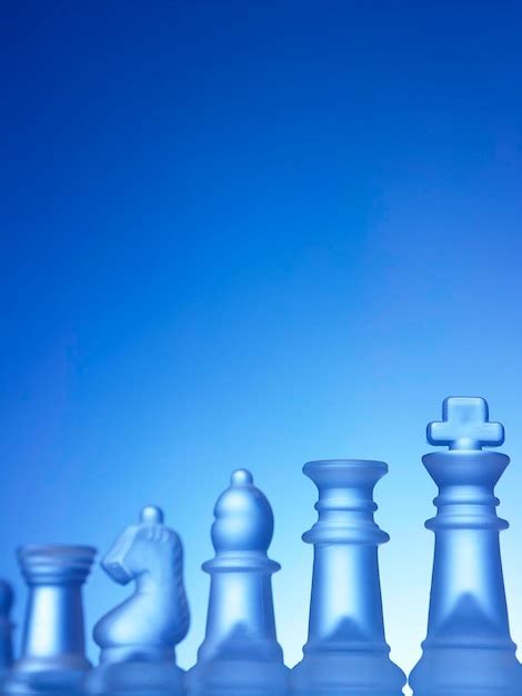 Premium Photo Close Up Of Chess Pieces Against Blue Background