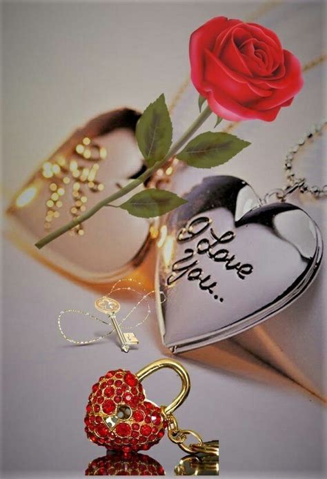 A Red Rose Sitting On Top Of A Heart Shaped Keychain Next To A Pair Of