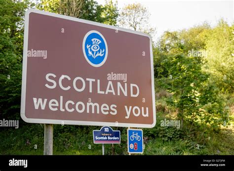 Scotland Welcomes You Road Sign On English Scottish Border With Cycle