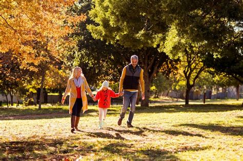 Premium Photo | Family walking at park