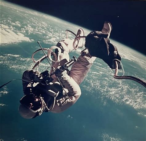 First US spacewalk, Ed White photographing the spacecraft during his ...