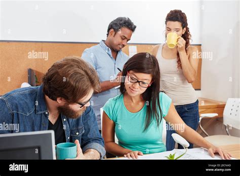 Students In Teamwork At University Learn Together As Team Stock Photo