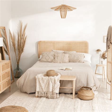 A Bedroom With White Walls And Beige Bedding Is Pictured In This Image