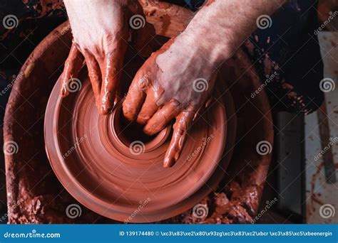 Professional Potter Making Bowl In Pottery Workshop Studio Stock