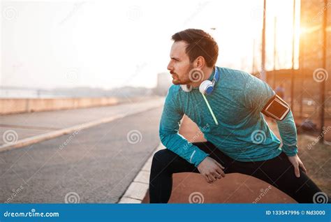 Handsome Man Stretching Before Exercising Stock Photo Image Of Player