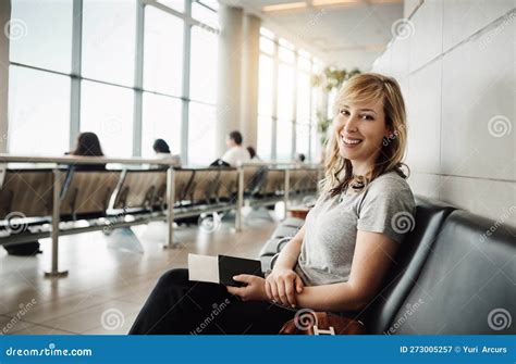 Eagerly Waiting For My Flight Cropped Portrait Of An Attractive Young