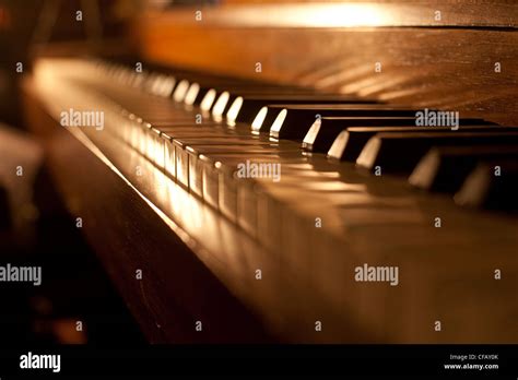 Closeup Of Antique Piano Keys And Wood Grain With Sepia Tone Stock