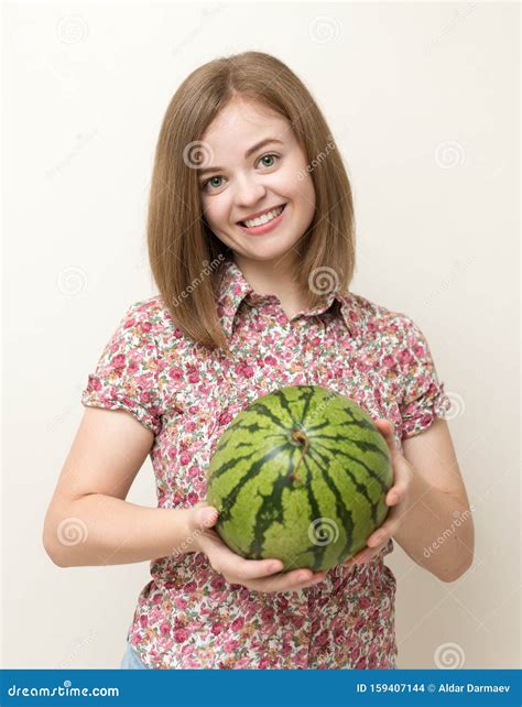 Portrait Of Smiling Caucasian Woman Girl With Green Watermelon In Her