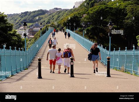 People Crossing Spa Bridge Scarborough North Yorkshire England Uk Stock