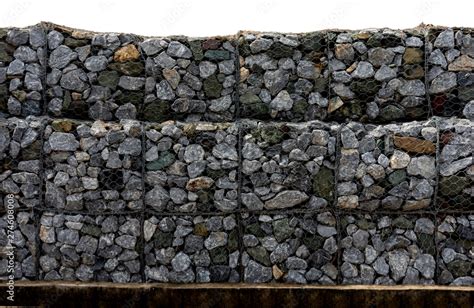 Foto Stock Retaining Stone Wall Next To The Road Protection Fence Or Wall Made Of Gabions With