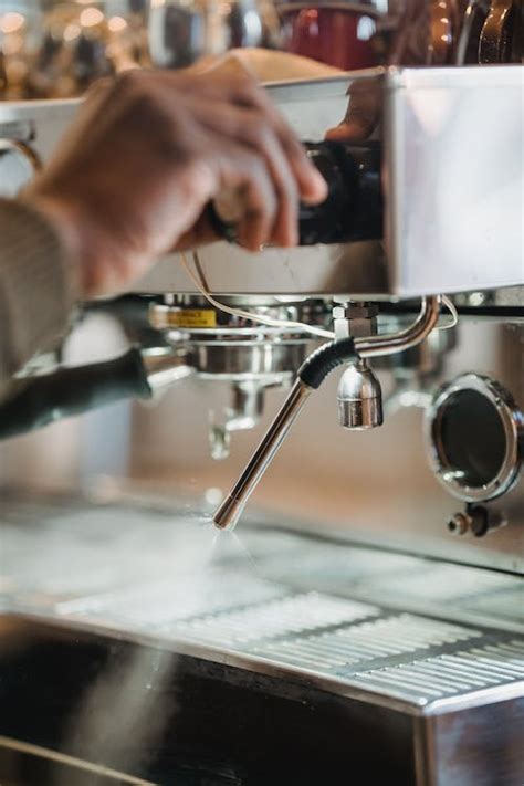 Barista Using Coffee Machine · Free Stock Photo